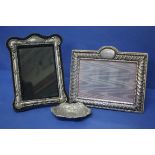 A silver photograph frame; together with another silver plated example; and a silver dish.