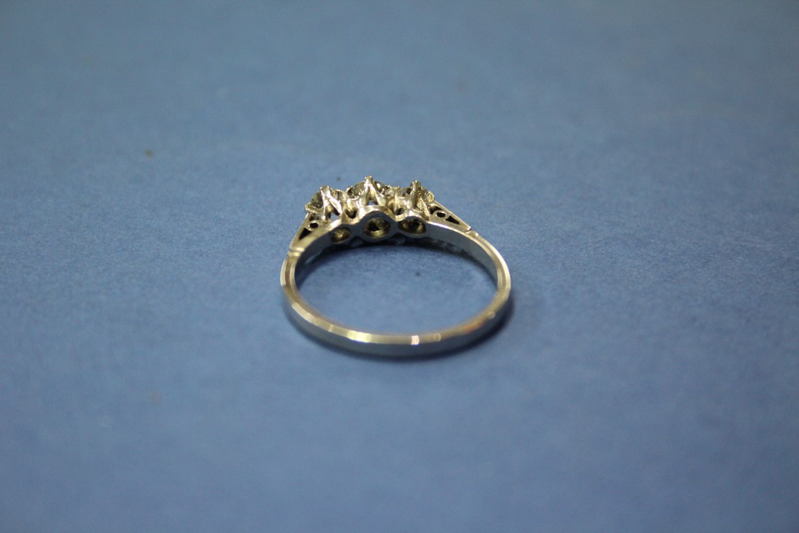 A platinum three stone diamond ring, 0.75ct approx. - Image 11 of 11