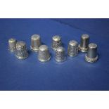 Eight silver thimbles, to include two by Charles Horner, and another metal thimble.