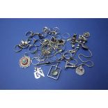 A selection of silver rings, pendants and necklaces.