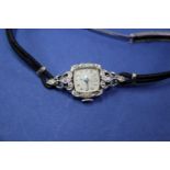 A vintage Bulova 14k white gold and diamond ladies wristwatch, 23 jewel,