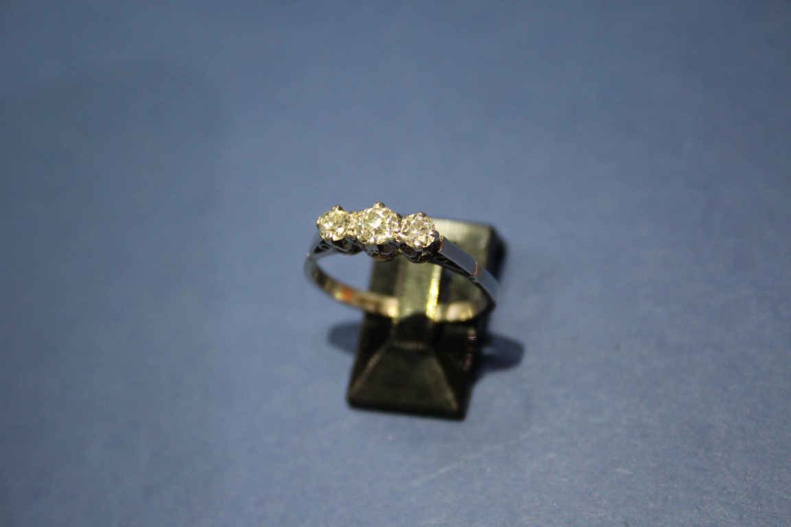 A platinum three stone diamond ring, 0.75ct approx. - Image 7 of 11