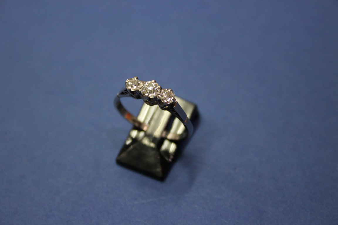 A platinum three stone diamond ring, 0.75ct approx. - Image 5 of 11