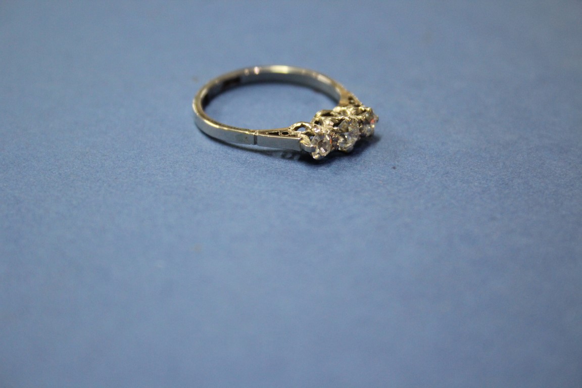 A platinum three stone diamond ring, 0.75ct approx. - Image 10 of 11