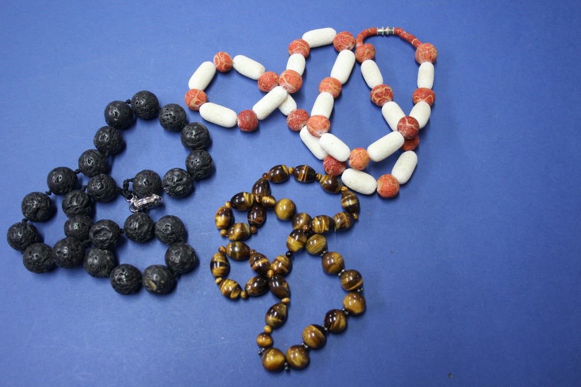 An Icelandic volcanic lava beaded necklace; together with a string of tiger's eye beads;