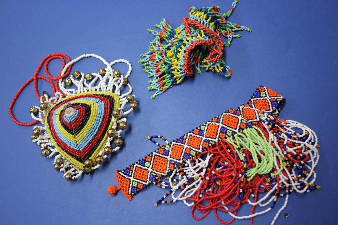 Two South American decorative bead work necklaces; together with another similar item.