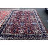 A large Indian carpet, having all over floral Persian design field. 344 x 260cm.