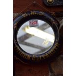 A souvenir 'HMS Queen Elizabeth' novelty lifebuoy wall mirror, 18.5cm diameter.