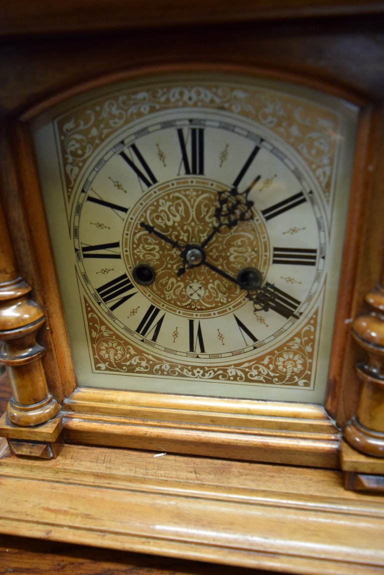 A Continental walnut mantel clock, 47cm high. - Image 2 of 3