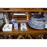 A quantity of Delft ware, to include tiles, plates and chargers.