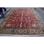 A large Persian Tabriz carpet, having all over floral palmette design,