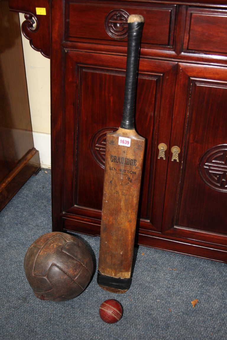 A vintage Gradidge cricket bat; with cricket ball; and vintage stitched leather football.