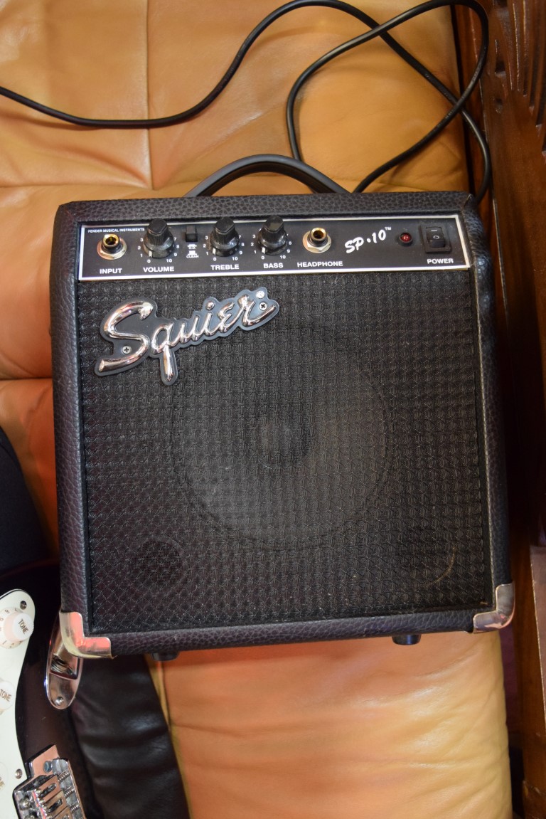 A Fender Squier Strat electric guitar, in padded bag; together with Squier SP10 amp. - Image 4 of 5