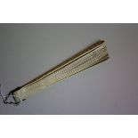 A Chinese Canton carved ivory brise fan, late 19th century, the guards 19cm long.