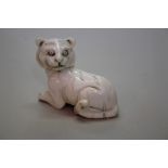 A Japanese carved ivory netsuke of a tiger, Meiji period, signed, 4.4cm long.