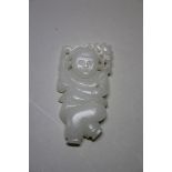 A Chinese carved and pierced white jade figure of a boy, 7cm high.