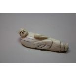 A Japanese carved ivory netsuke of a sage, 18th.19th century, 6cm long.