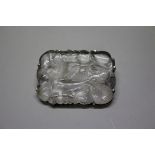 A Chinese carved and pierced rock crystal and silver mounted brooch,