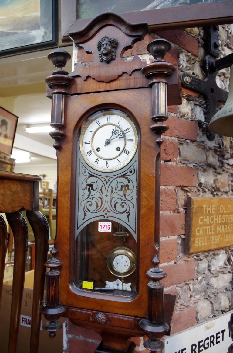 A Vienna style walnut wall clock, 85cm high.