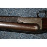 An antique McCarthy, Buck & Co 12 bore double barrel shotgun, deactivated.