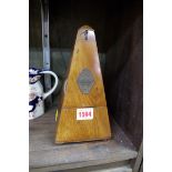 A Maelzel walnut metronome.