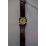 A 9ct gold Perfex gentleman's wristwatch, brown leather strap.