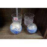 Two similar Isle of Wight glass paperweights; together with a pair of Stuart crystal tumblers.