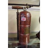 An unusually small copper fire extinguisher,