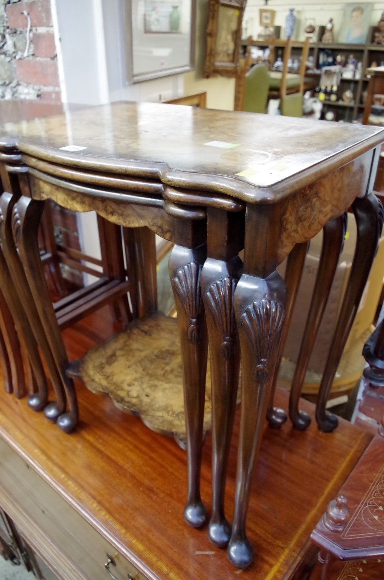 A nest of three figured walnut tables, largest 57.5cm wide. - Image 2 of 2