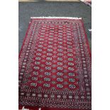 Two Pakistan Bokhara design rugs; together with a Pakistan runner;