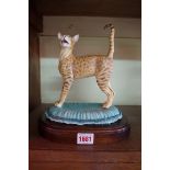 An Avalon 'Oriental Chocolate Spotty Tabby', No.10/100, 22cm high, on wood base.