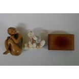 A Japanese carved wood erotic netsuke, signed,