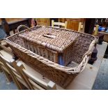 A large wicker twin handled rectangular basket,