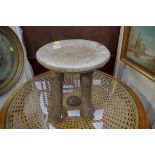 Ethnographica: a tribal wood four legged stool, 29cm diameter.