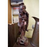 A Japanese carved wood figural lamp base.