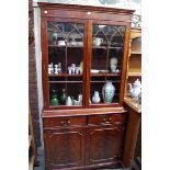 A reproduction mahogany bookcase, 99cm wide.