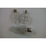 Three various hobnail cut perfume flasks, having metal screw caps.