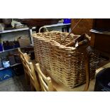 A large wicker basket, 103cm wide.