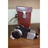 Cameras: a Voigtlander lens, in original leather case.