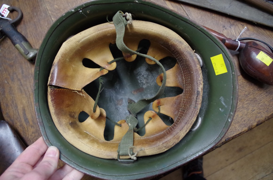 An old green painted military tin helmet. - Image 2 of 2