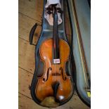 A antique Continental violin, with 14in back, with bow and hard case.