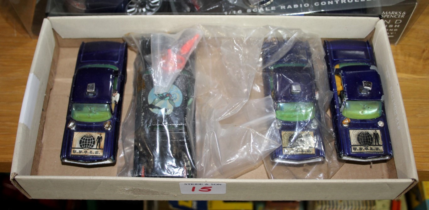 A Corgi Toys 'The Green Hornet's Black Beauty'; together with three Corgi 'U.N.C.L.