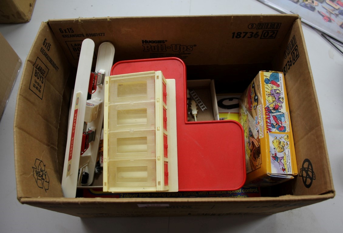 A mixed box of toys, to include a Corgi Juniors multi-garage; a Corgi 'The Wizard' 98758,
