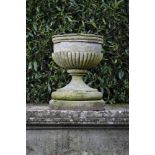 Garden Urns/Planters: A Victorian carved stone urncirca 1840, 71cm.; 28ins high
