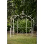 Garden Furniture: A wrought iron semi-circular arbourearly 20th century285cm.; 112ins high by