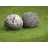 Architectural/Finials: A pair of composition stone gatepier balls36cm.; 14ins diameter