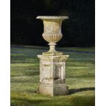 Garden urns/Planters: A carved white marble urn,2nd half 19th century, on later composition stone p