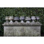 Garden urns/Planters: A harlequin set of seven marble urns, 31cm.; 12ins high