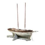 An unusual pond yacht lugger late 19th century on later wooden stand194cm.; 76ins high by 168cm.;