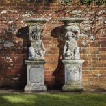 Garden urns/Planters: A pair of composition stone putti planters on pedestals2nd half 20th century15